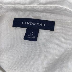 Men’s small white button tee.